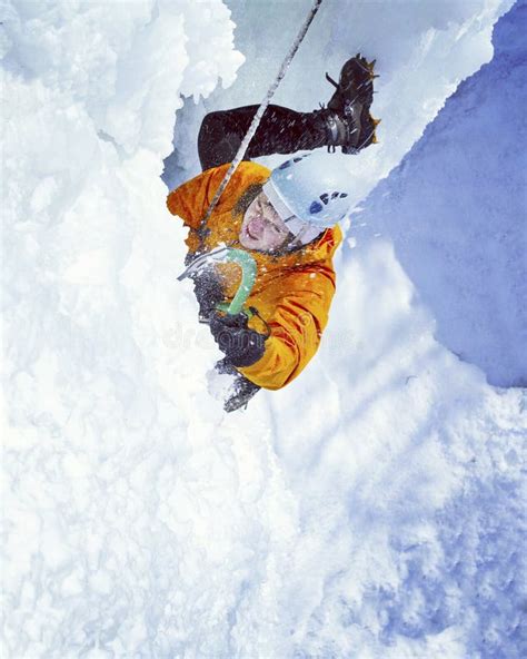 Man Climbing Frozen Waterfall Stock Image Image Of Gutsy