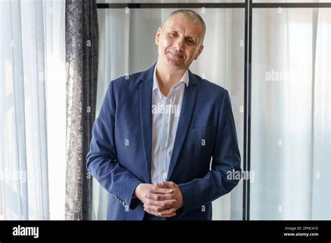 Portrait Of A Mature Calm Businessman With His Jacket Unbuttoned Stock
