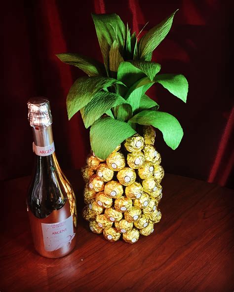 Pineapple Made With A Bottle Of Wine Covered With Ferrero Rocher Candy