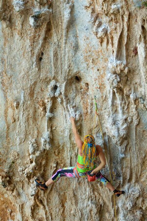 Sport Rock Climber Girl On Challenging Overhanging Climbing Route In