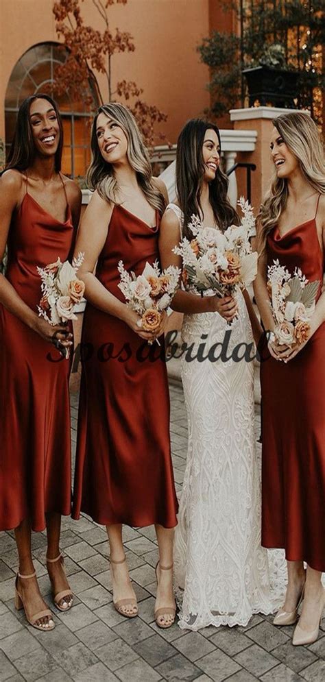 The Bridesmaids Are All Wearing Red Dresses And Holding Bouquets In