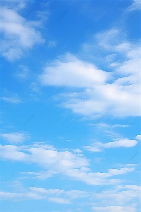 A Blue Sky Covered With A Few Clouds Background Wallpaper Image For ...