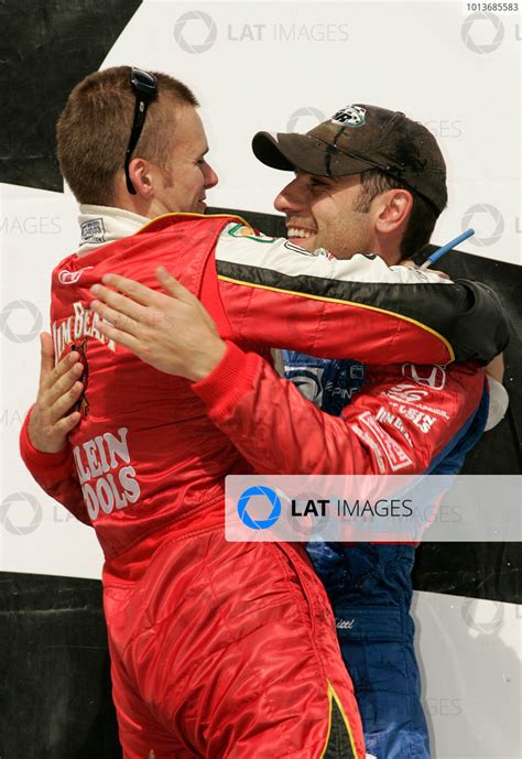 21-22 August, 2004, Colorado Springs, Colorado, USA Franchitti hugs Wheldon Â©2004, Michael L ...