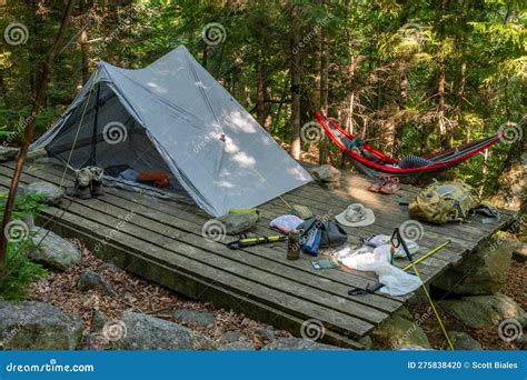 Camping With Tent And Hammock With Supplies And Gear All Over The Place