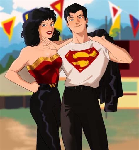 A Man And Woman Dressed Up As Superman And Wonder