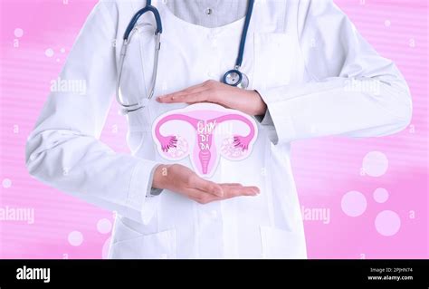 Doctor Demonstrating Virtual Image Of Infected Female Reproductive