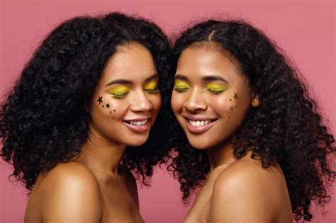 Premium Photo Shirtless Women With Face Paint Against Wall