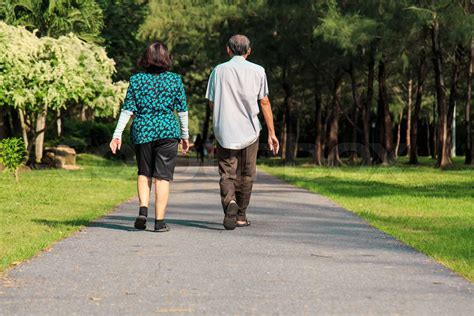 Old People Walking In The Park Stock Image Colourbox