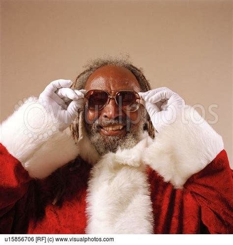 Cool African American Santa Claus Straightening His Glasses And Smiling