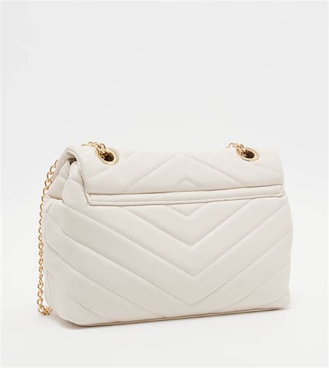 Buy Tyra Quilted Flap Crossbody Bag In Beige 6thstreet Saudi Arabia