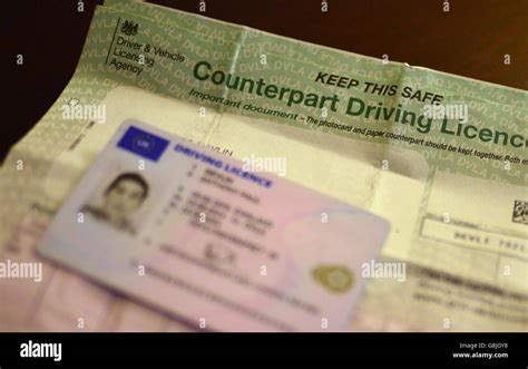 A UK Driving Licence Shown Beside A Counterpart Driving Licence London