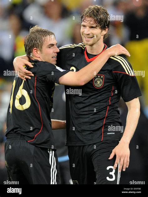 German Captain Philipp Lahm L And Defender Arne Friedrich Celebrate