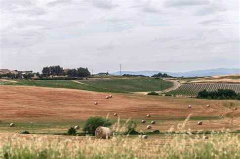 Premium Photo View Over The Tuscany Hills With Bales Of Hay And Few