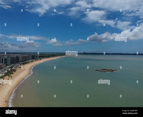 Aerial View Of Camburi Beach With Soft Sand Under A Cloudy Sky In