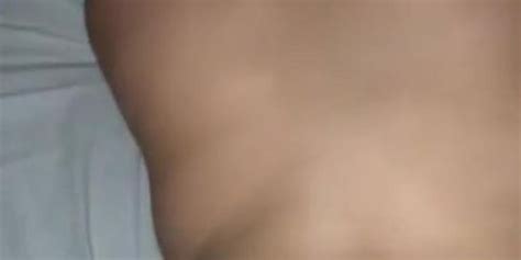 TEEN BRUNETTE TAKING BACKSHOTS WHILE PARENTS ARE IN LIVING ROOM