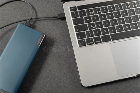 Laptop Is Charged By Powerbank Top View Laptop Is Connected By Cord To