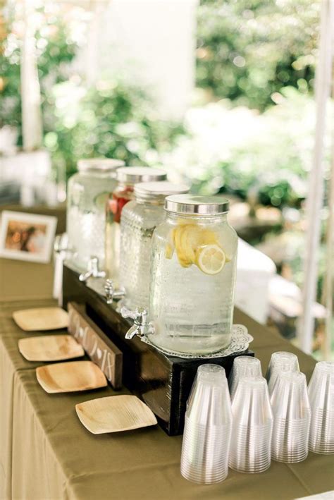 Mason Jars With Lemons Are Lined Up On A Table