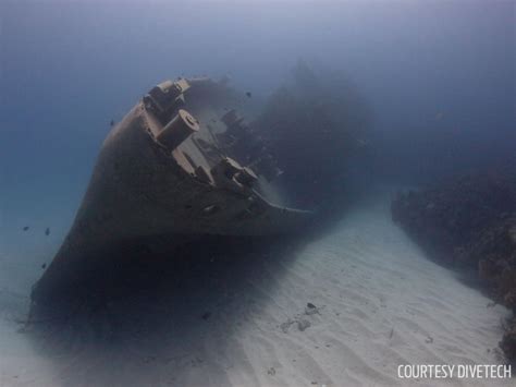 History Of Grand Cayman's Kittiwake Shipwreck | Scuba Diving