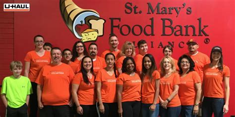 U Haul Team Members Pack Food For The Hungry At St Marys Food Bank