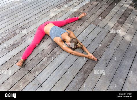 Woman in yoga straddle position hi-res stock photography and images - Alamy