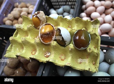 'Thousand year old' eggs on display at the large local food market in Kunming, Yunnan Province ...