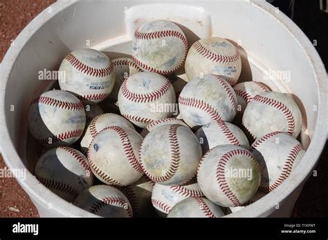 A Group Of Baseballs In A Bucket Stock Photo Alamy