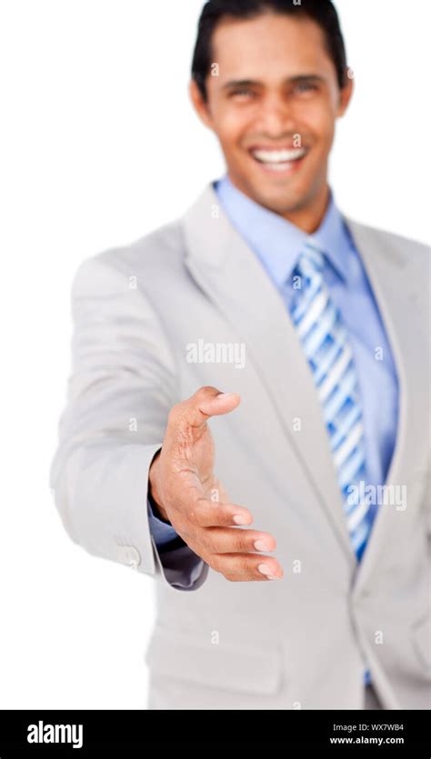 Confident Businessman Reaching Out To Shake Hands Isolated On A White