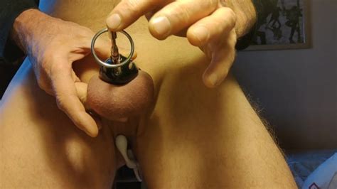 Urethral Sounding While Locked Into Chastity Cage