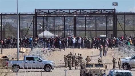 Hundreds of migrants gather at border wall as court debates SB4