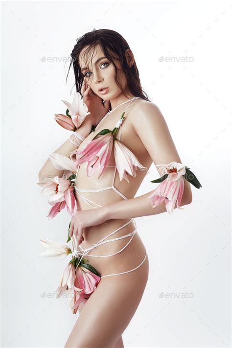 Nude Woman Tied With A Rope With White Pink Lily Flowers Girl With Wet Hair Facial Skin Stock