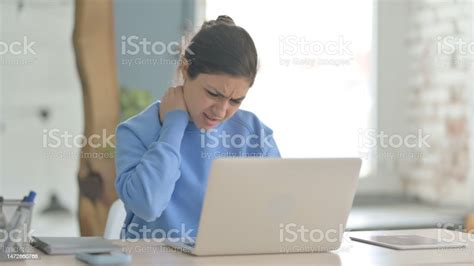 Indian Woman Having Neck Pain While Using Laptop Stock Photo Download