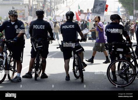 Officers On Bicycles Keep Watch As Demonstrators Protesting Several