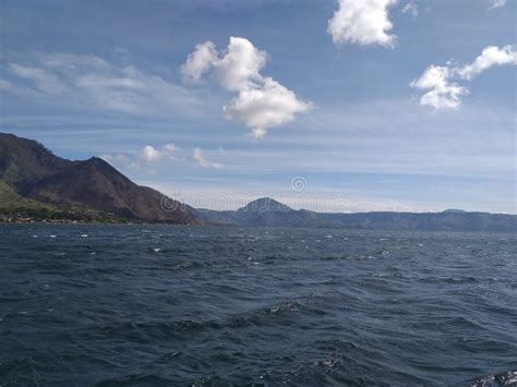 A Sunny Day With Few Clouds And A Breeze On The Lake Stock Photo