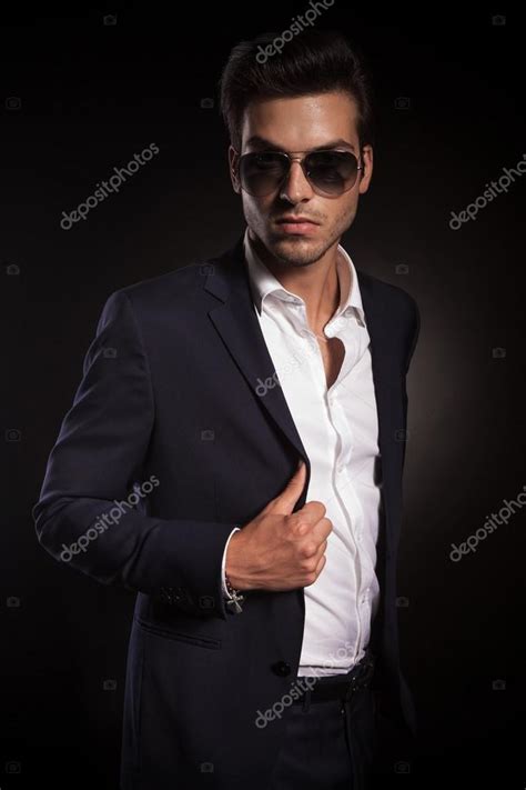 Elegant Business Man Posing On Black Studio Background Stock Photo By