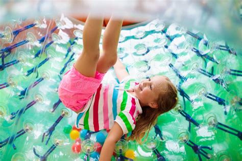 Child Play In Roller Wheel Kids On Trampoline Stock Photo Image Of