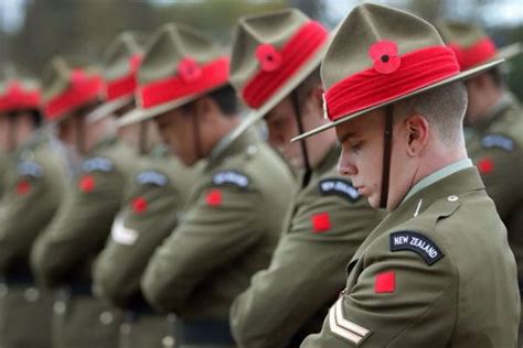 New Zealand Soldiers Bow Their Heads In Remembrance At Anzac Day