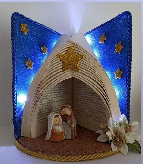 An Open Book Shaped Like A Nativity Scene With Stars On The Top And A