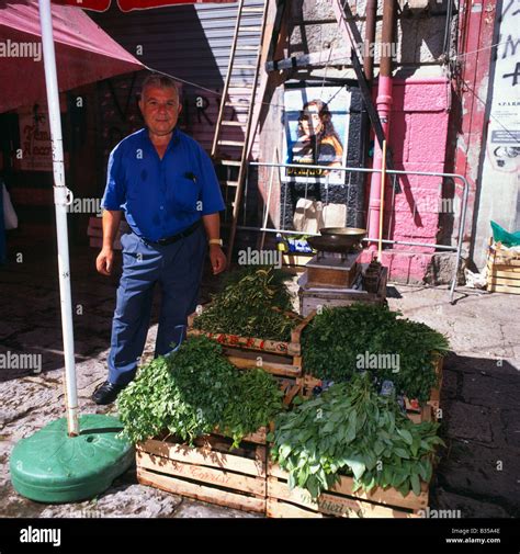 Man Standing By His Herb Stall In La Vucciria Market Palermo Sicily