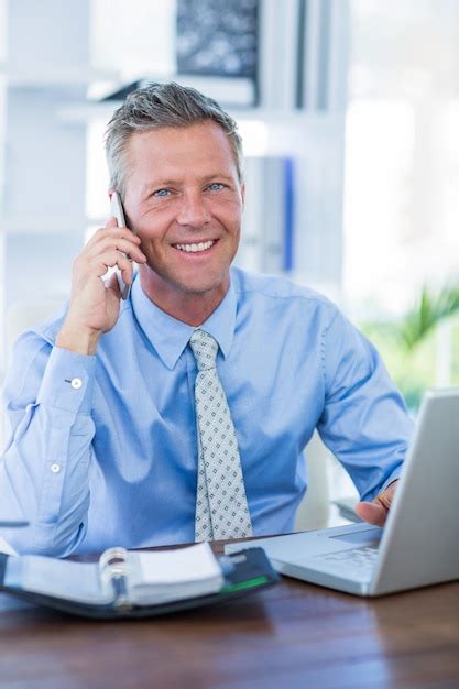 Premium Photo Serious Businessman Having Phone Call