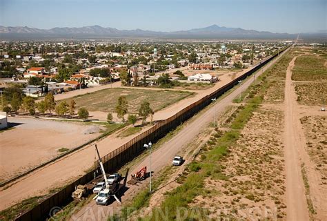 Aerialstock Aerial Photograph Of The Wall Border Fence Between Mexico