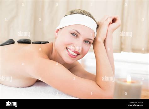 Beautiful Blonde Enjoying A Hot Stone Massage Stock Photo Alamy