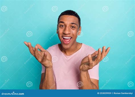 Photo Of Shocked Excited Young Guy Wear Pink T Shirt Rising Arms