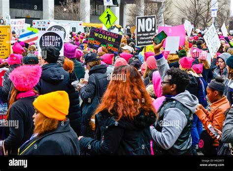 Large Crowd Of Protesters Many Wearing Pink Pussy Hats Holding Anti