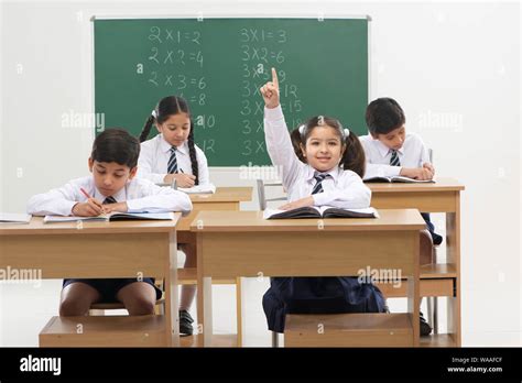 School Children Studying In A Classroom Stock Photo Alamy