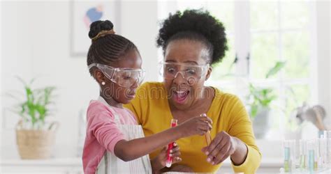 Excited African American Granddaughter And Grandmother Make Chemistry