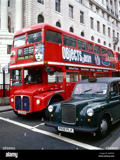 Routemaster Buses And A Black Cab In London Stock Photo Alamy