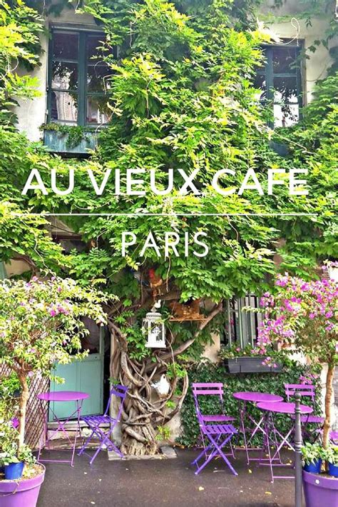 The Entrance To Au Vieuxx Cafe Paris With Purple Chairs And Trees In Front