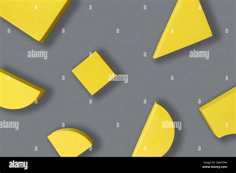 Flat Lay Composition Of Yellow Geometric Shapes On Gray Background