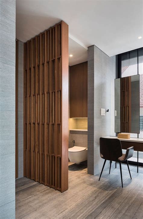 A Modern Bathroom With Wood Paneling On The Walls