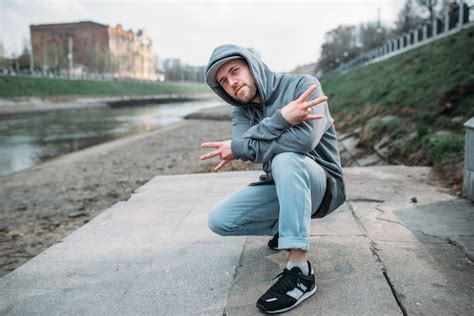 Premium Photo | Male rapper posing on the street, urban dancing